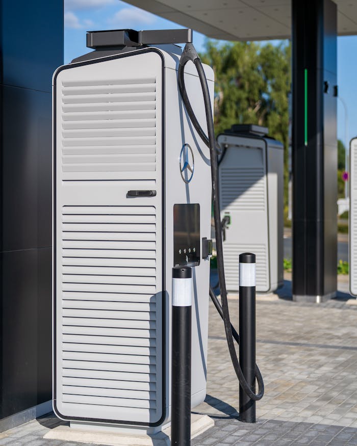 wedding-photographer-03 A sleek electric vehicle charging station under a clear blue sky, showcasing modern infrastructure.